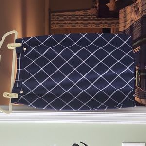 Navy Blue Pencil Skirt with Gold buttons in the frontcand a slit in the back.